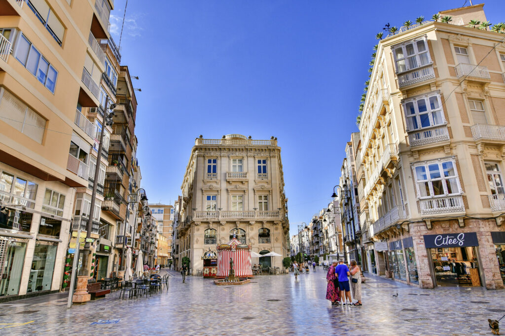 Elegant modernist buildings lining a pedestrian street in Cartagena, Costa Blanca