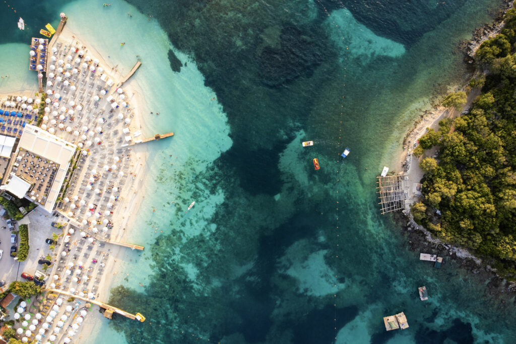 10 Trendy Beaches in Europe for 2026 Aerial view of Ksamil Beach's turquoise water and small islands