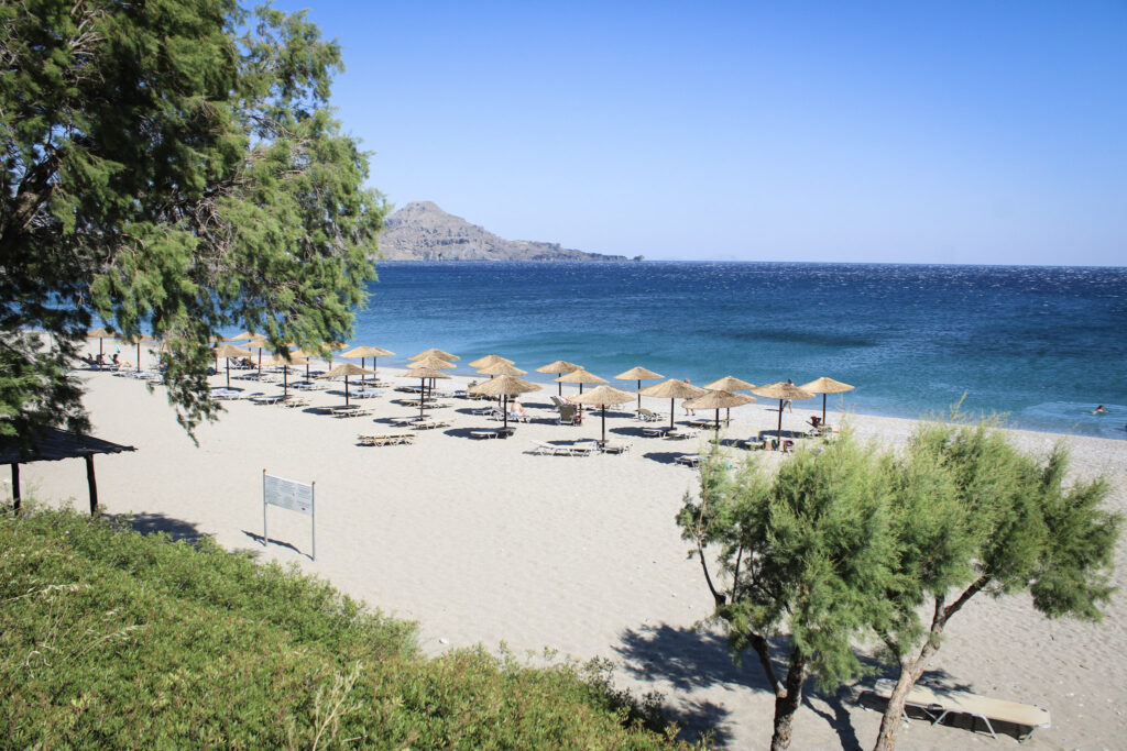 Best 10 Beaches in Crete, Greece Palm-fringed sand and umbrellas at Vai Beach's natural palm forest, Crete