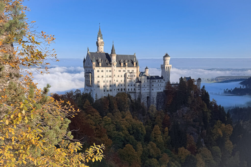 3 Days in Bavaria, Germany Neuschwanstein Castle in Bavaria Germany surrounded by autumn foliage and low fog