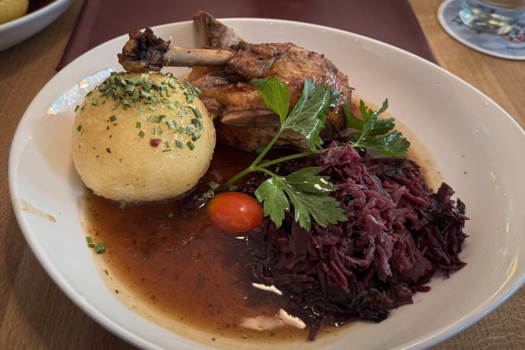 3 Days in Bavaria, Germany Traditional Bavarian roast duck served with a large potato dumpling, braised red cabbage, and rich gravy