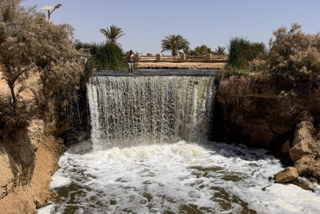 3 Days in Cairo, Egypt Water rushing over the natural stone ledge at the famous Wadi El Rayan Waterfalls in El Fayoum Oasis, Egypt