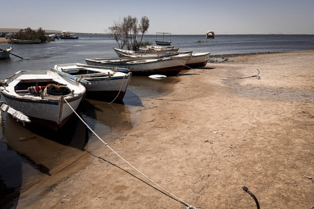 3 Days in Cairo, Egypt Traditional wooden boats tied to the sandy shore of Lake Qarun in El Fayoum Oasis, Egypt