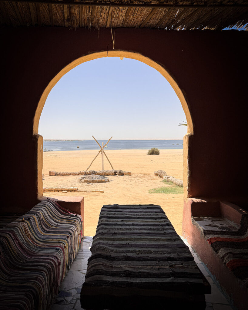 3 Days in Cairo, Egypt A traditional desert lounge with an earthen archway overlooking a scenic lake in El Fayoum Oasis, Egypt