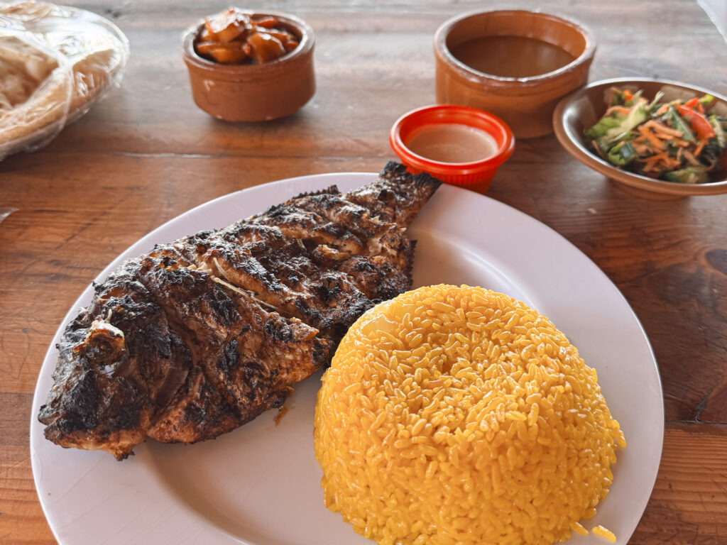 3 Days in Cairo, Egypt A plate of traditional Egyptian grilled fish and yellow rice served with tahini sauce and side salads in Egypt