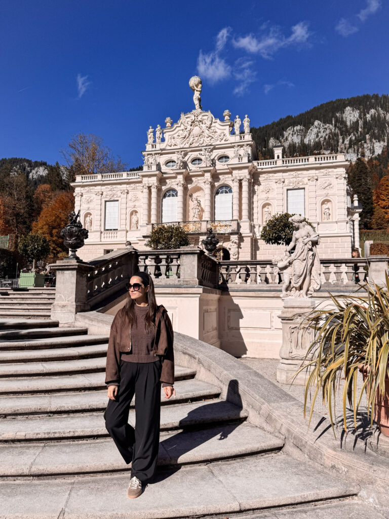 3 Days in Bavaria, Germany Traveler standing on the palace steps outside Linderhof Palace in Ettal Germany