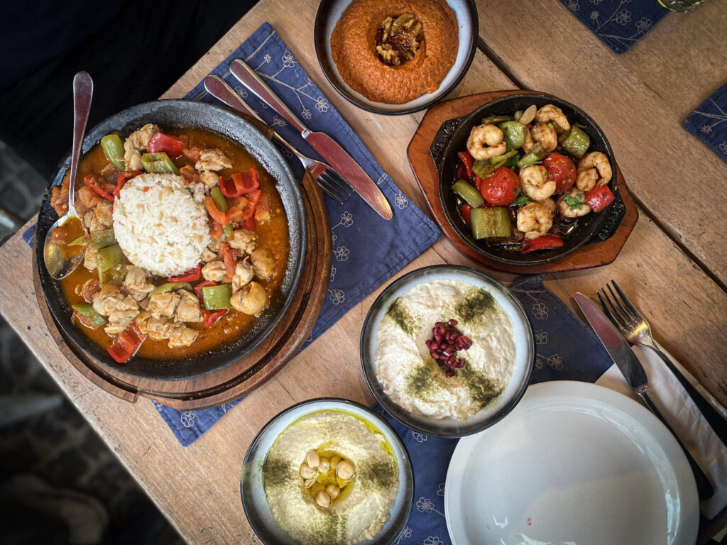 3 Days in Istanbul, Turkey Turkish meal spread with chicken casserole, shrimp, and mezze plates, Istanbul