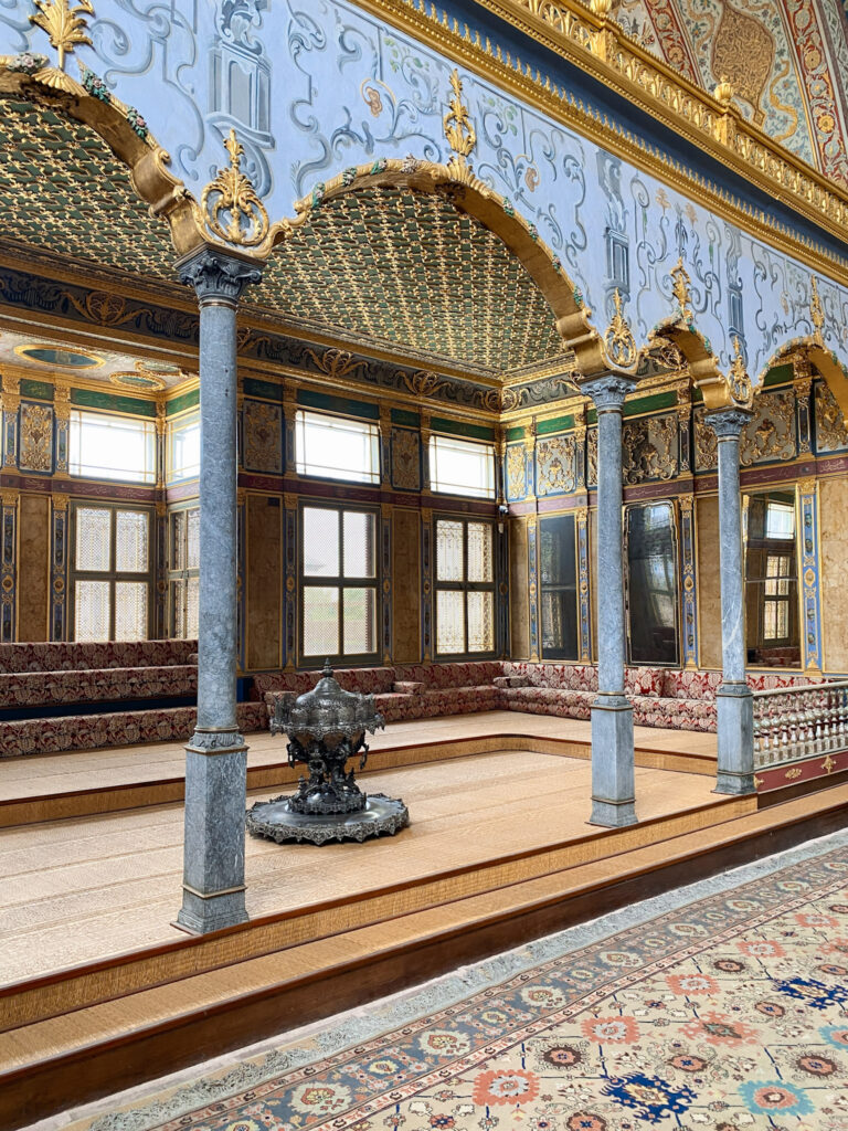 3 Days in Istanbul, Turkey The ornate Imperial Hall inside the Harem of Topkapi Palace in Istanbul with gold arches and marble pillars