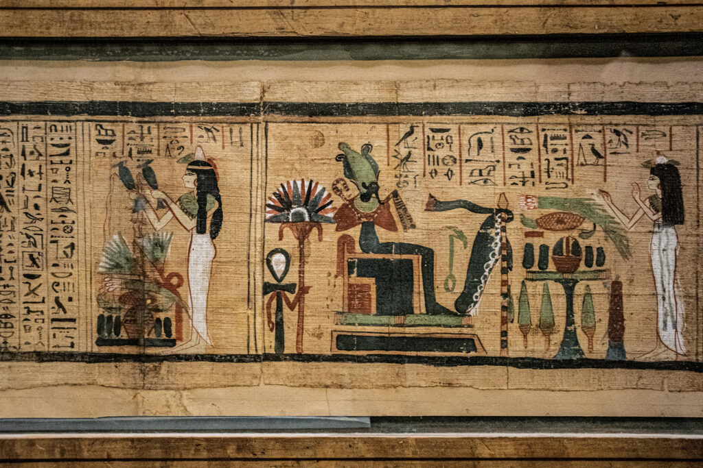 3 Days in Cairo, Egypt Close-up view of a historic Egyptian Book of the Dead papyrus manuscript detailing pharaonic religious art