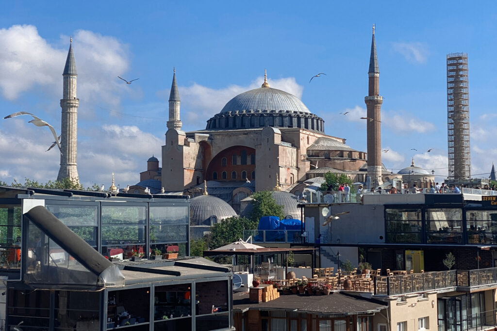 3 Days in Istanbul, Turkey Rooftop terrace view of Hagia Sophia mosque in Istanbul Turkey with seagulls flying on a sunny day