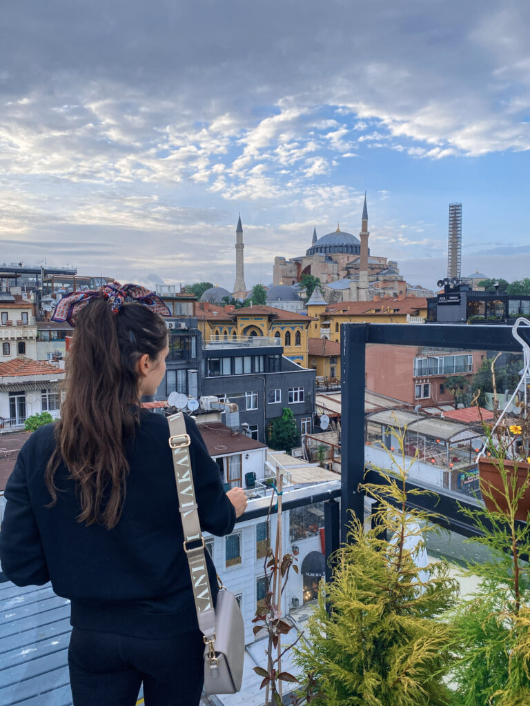 3 Days in Istanbul, Turkey Travel blogger from Jet Lag Jelly admiring the historic Hagia Sophia mosque from an Istanbul rooftop cafe